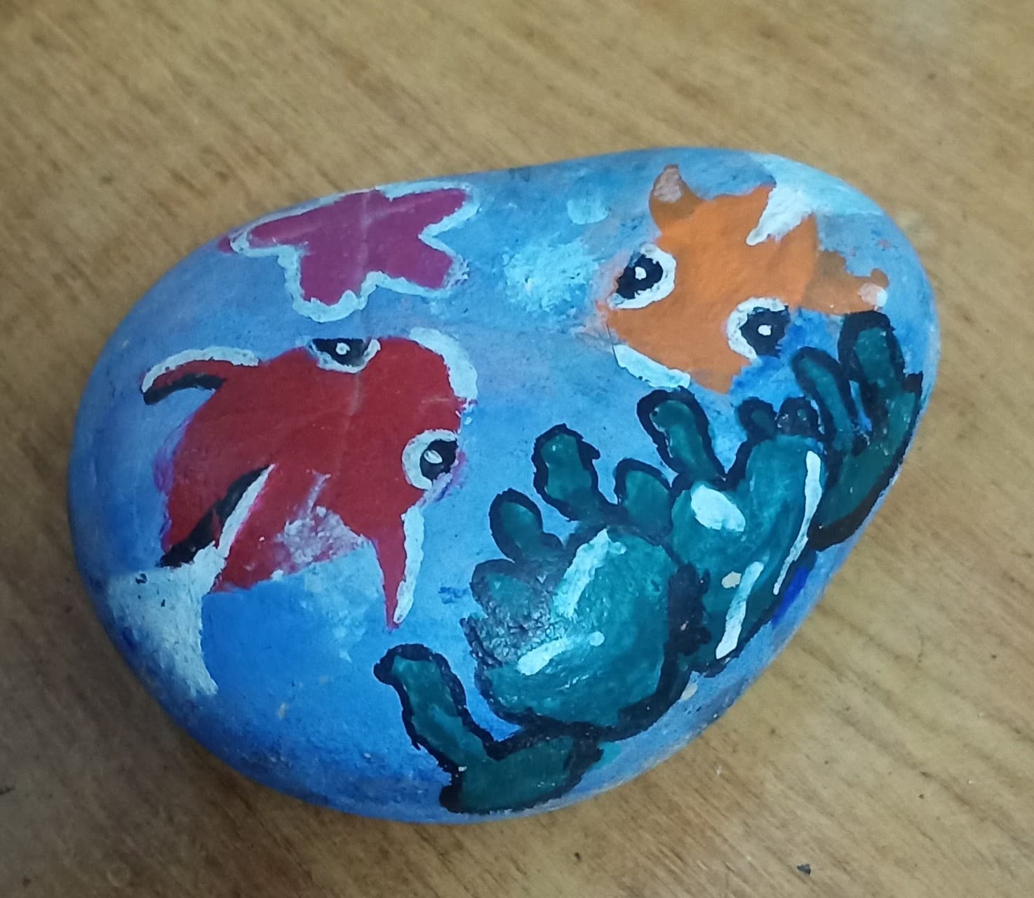 Two fishes in a sea painting